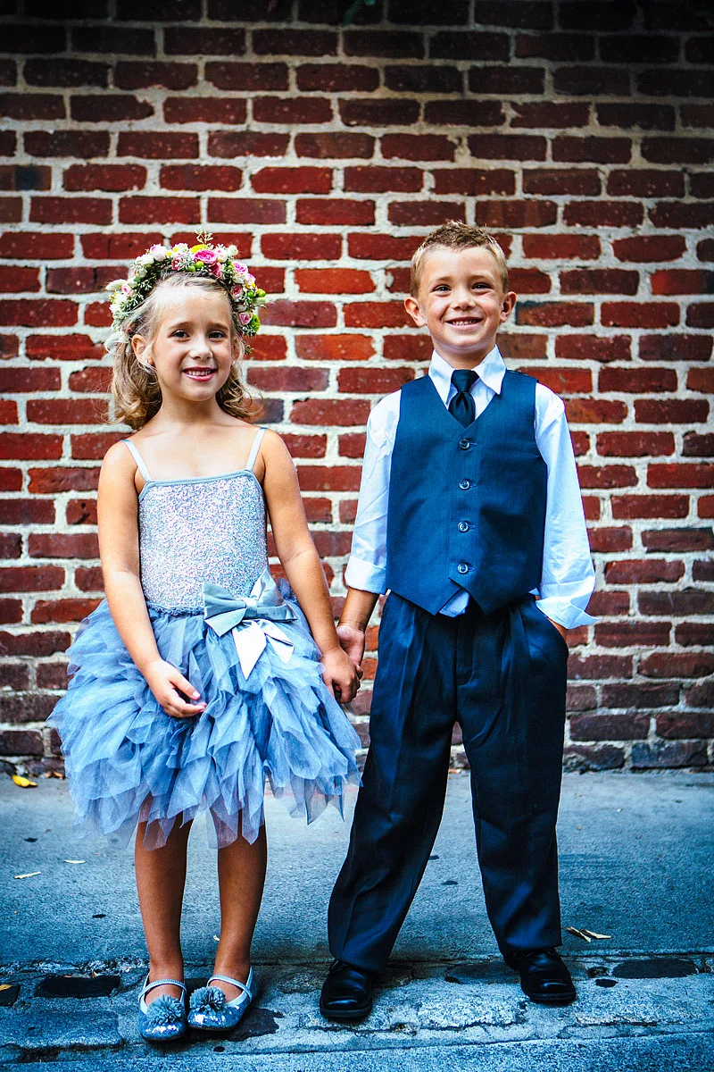 Flower girl and ring bearer holding hands