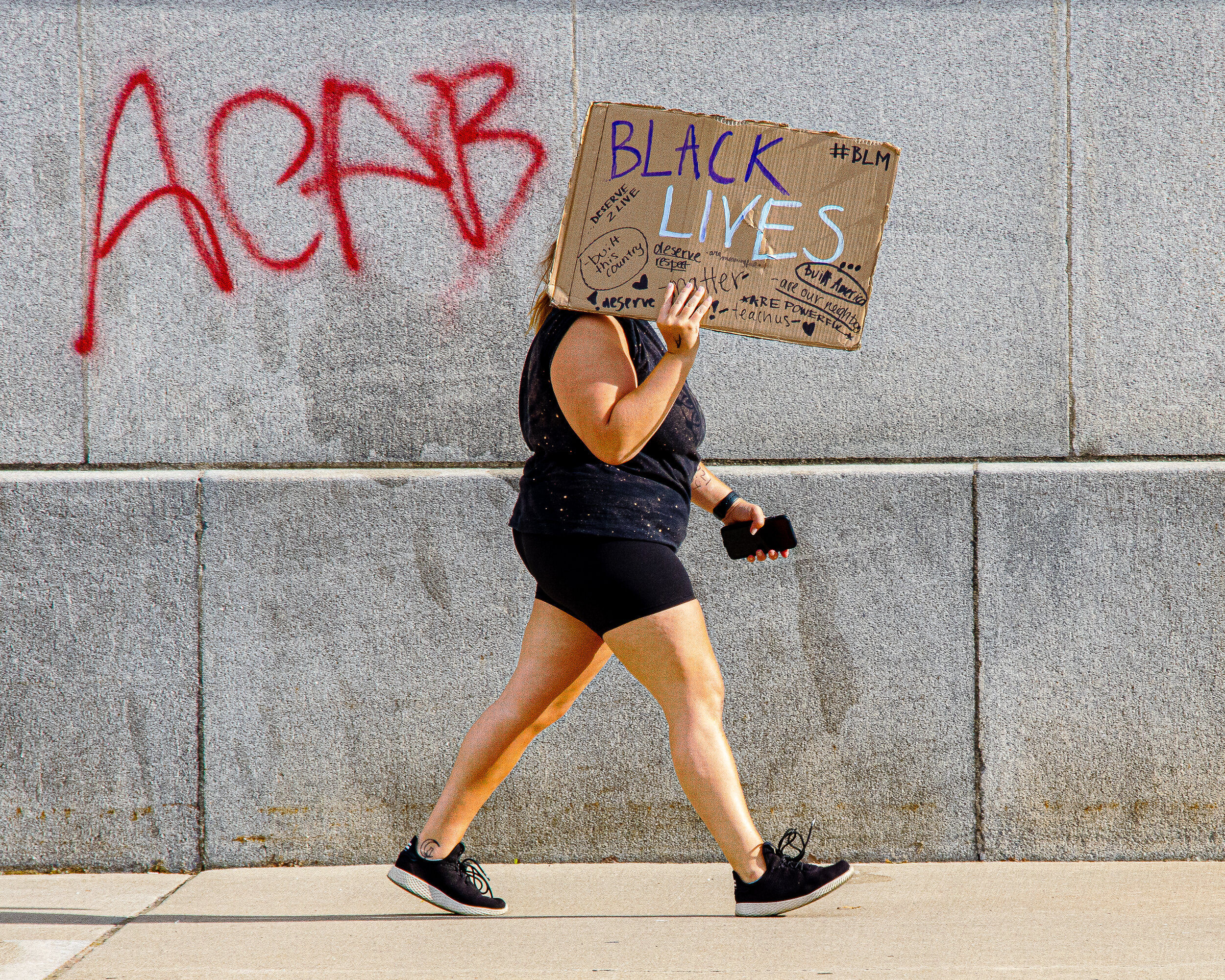  Hiding Behind a Sign-RibbonMat Gerdenich Photojournalistic Blue 