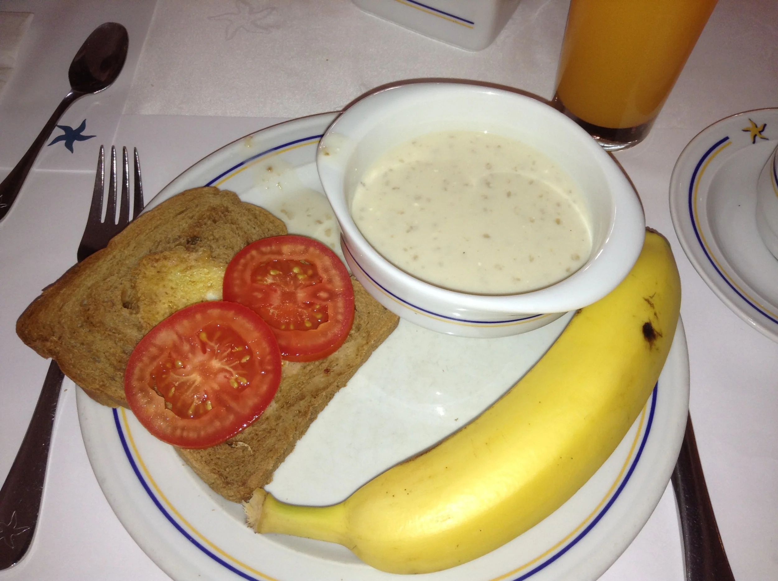 One egg on a slice of whole wheat toast with tomatoes, oatmeal and banana. They also offered a variety of green juice and carrot juice with most meals. 
