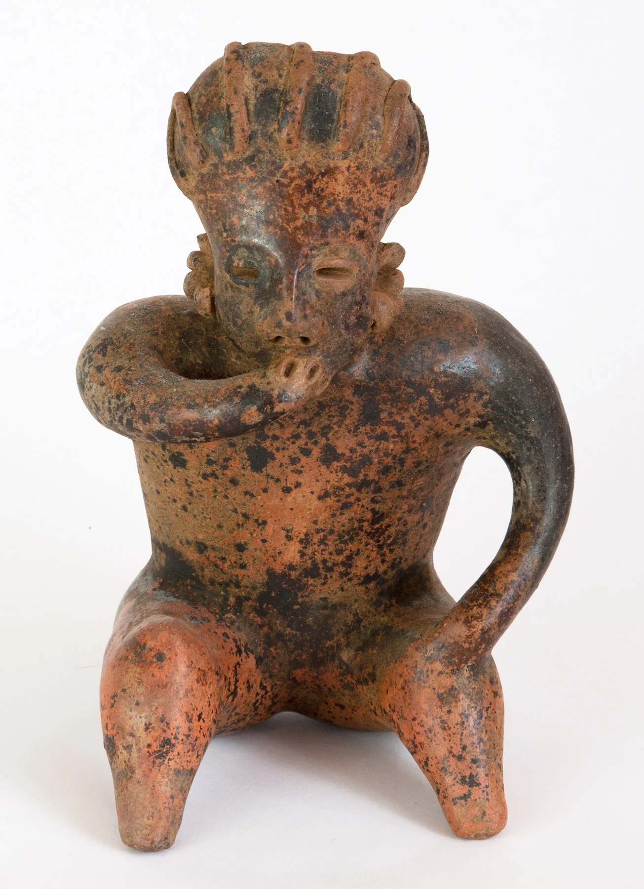 Nayarit seated figure with widened head, braided hair, hand to mouth, red slipped grey terracotta. 200 BC-200 AD 8-2/5" high