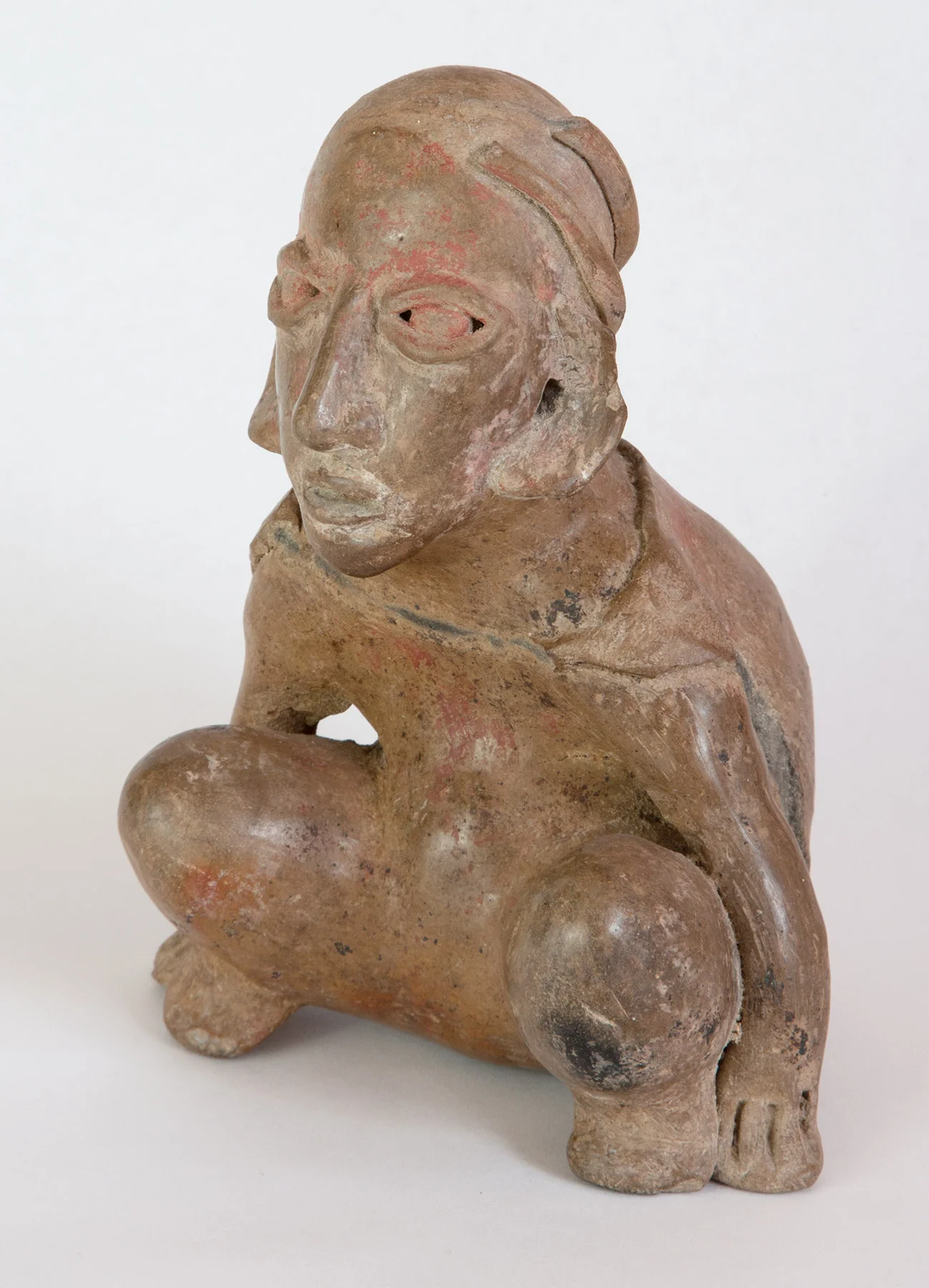 Jalisco buff terracotta figure representing a crouching dwarf 200 BC-200 AD 7-1/2" high