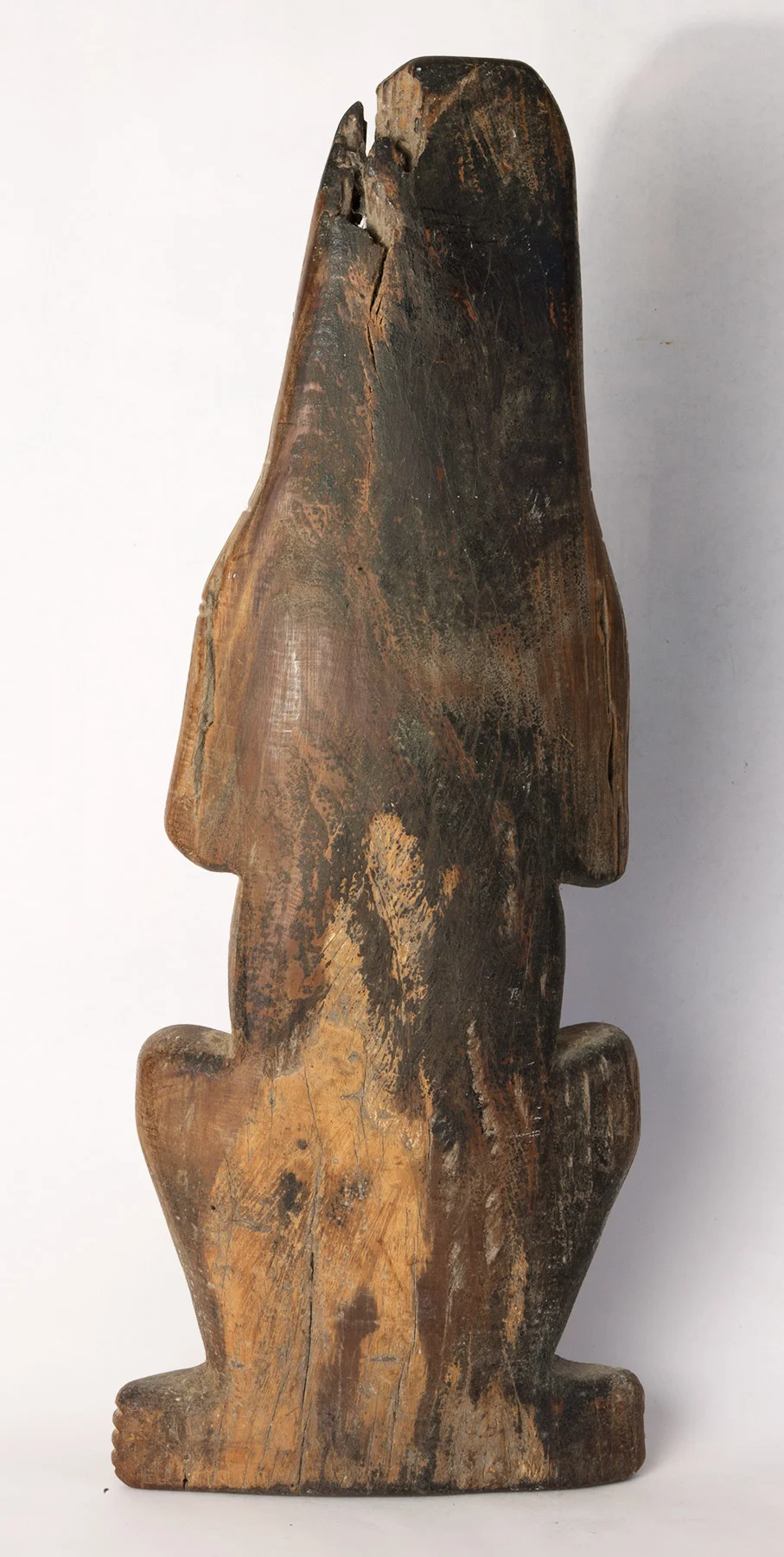 Carib carved wood figure with hands to head. Possibly 16th century. 21" high.