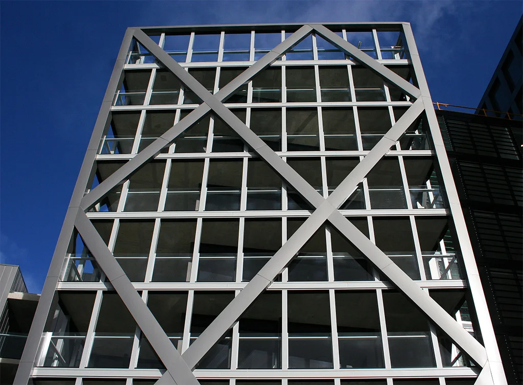 Diamond Diagonals clad in custom made PVDF Aluminium Silver Grey