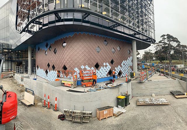 Botanicca 3 Richmond. Custom designed shingles to accomodate the project curves. Material @vmzincaustralia Pigmento Red. Proudly designed, supplied and Installed by the Archclad team. #cladding #metalcladding #shingles #feature #featurewall #tested #