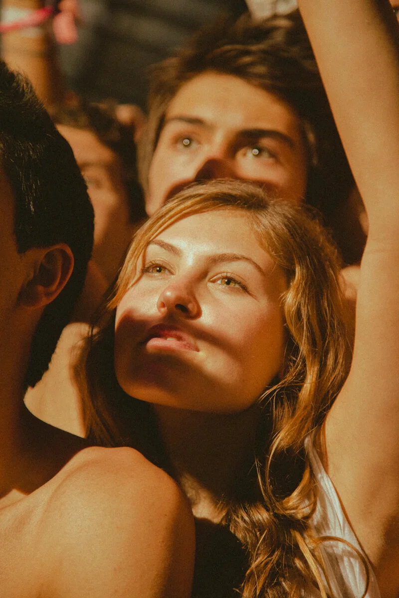 A girl amongst a sea of other people at Coachella