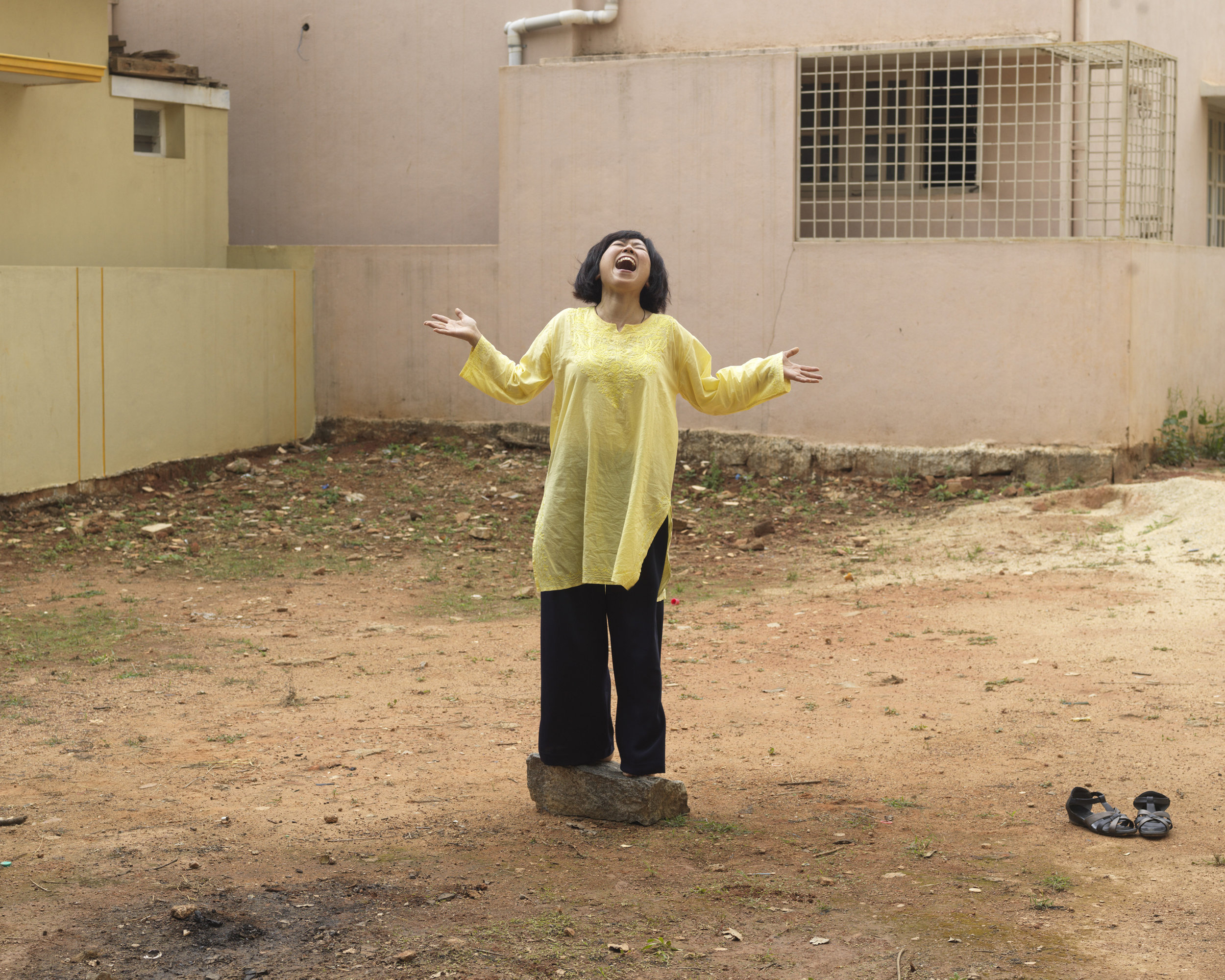Rie Sakamoto, a workshop participant at Dr. Madan Kataria's "Laughter Yoga" class, 2016. Photographed in Bangalore, India for The New York Times
