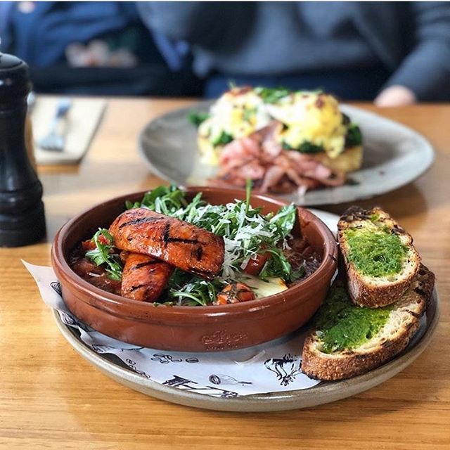 Making the most of this beautiful Saturday ☀️with brunch in the form of shakshouka with red pepper confit, goats cheese and chorizo, and eggs benny with bacon. 
via @invidiaz

#cookandarchies