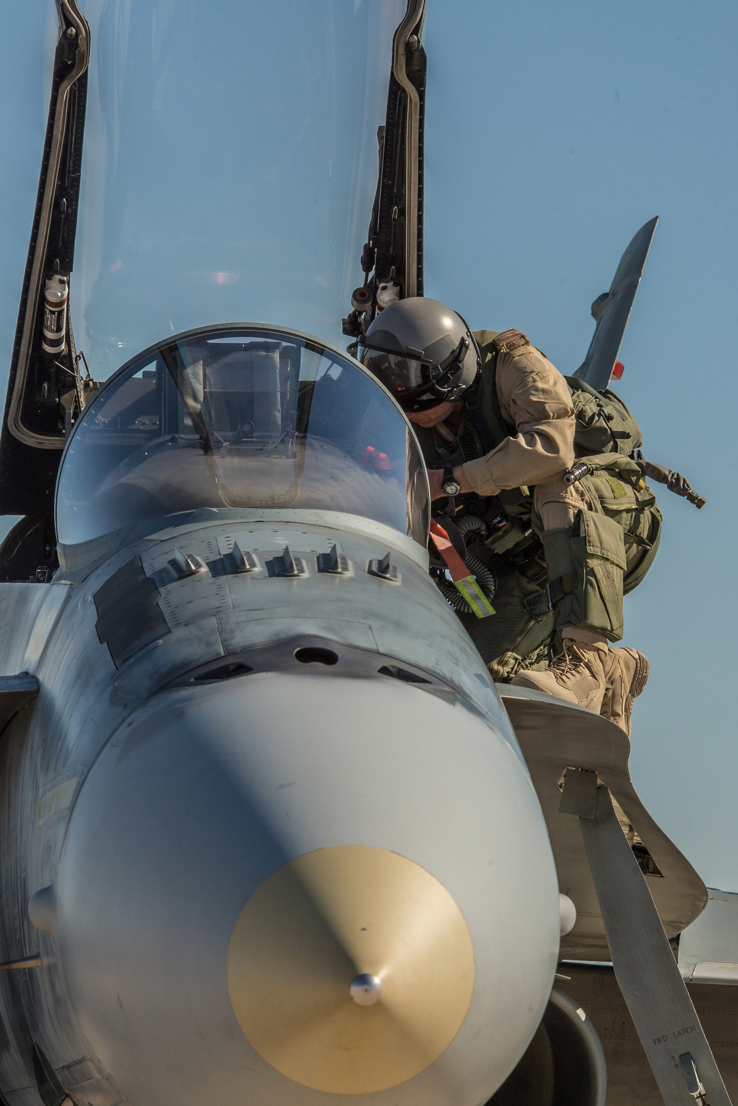 A CF-18 pilot outside his cockpit during Operation IMPACT in Iraq.
