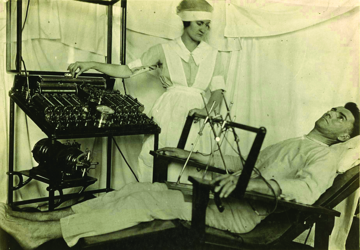 A shell-shocked soldier being treated with electrical shock treatment by a nurse. The Bergonic chair was an aparatus devised to administer general electric shock treatment for psychological effect, in psychoneurotic cases during the Great War.