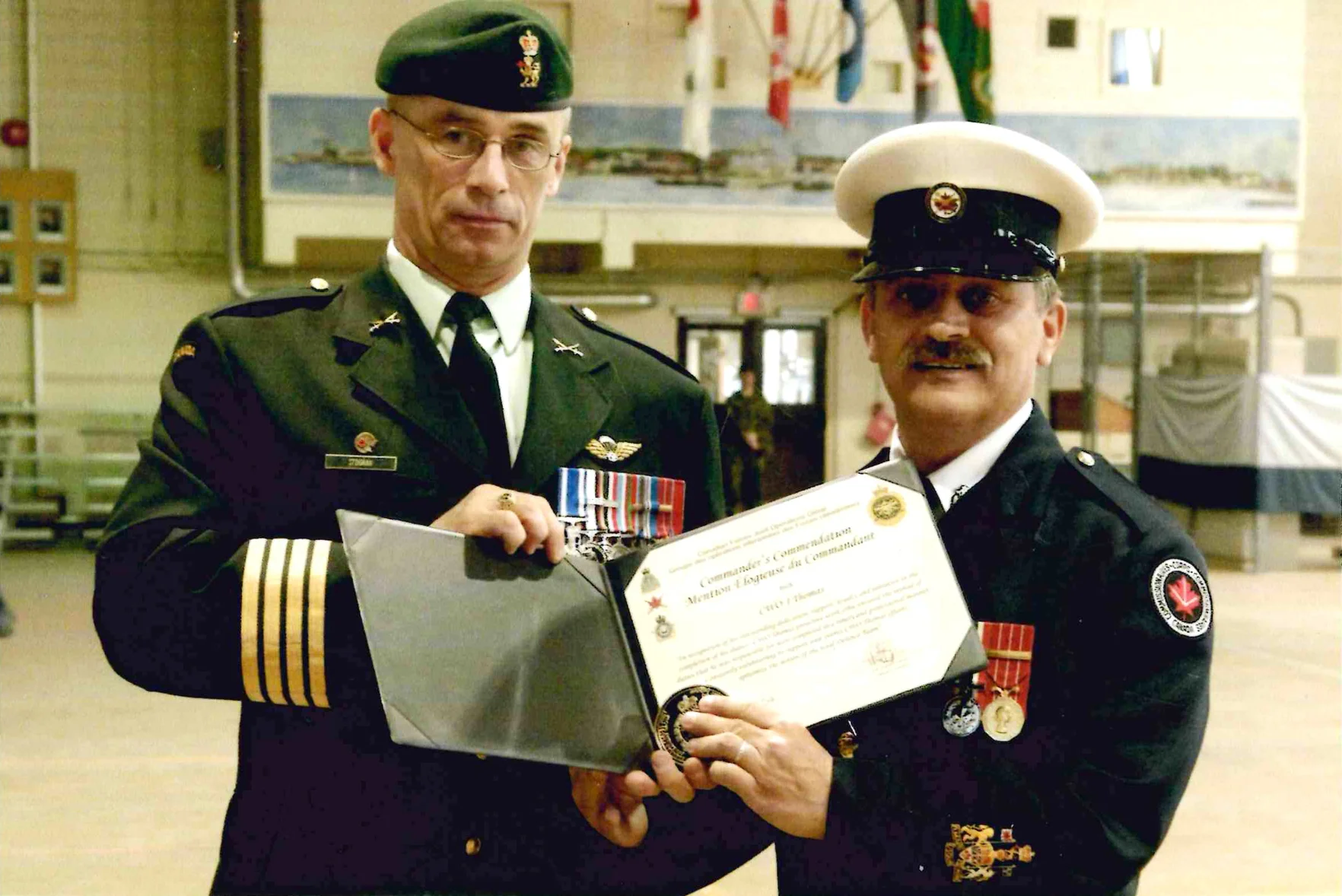 Joe Thomas, right, has won several awards and commendations — both during his time in the Canadian Forces and as a Commissionaire. 