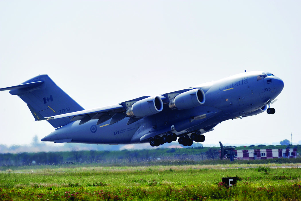 A CC-177 Globemaster III of 429 Transport Squadron Trenton taking off from Trapani, Italy in March 2011, during its deployment as part of the NATO mission against Libya. In January 2009, the Aerospace Industries Association of Canada called for an independent review of the defence procurement system, amid concerns about the lack of work offered to domestic firms on the multi-billion-dollar purchases of the C-17s — as well as the Chinooks and C-130Js — for the Royal Canadian Air Force. (Cpl. Marc-André Gaudreault, Combat Camera)