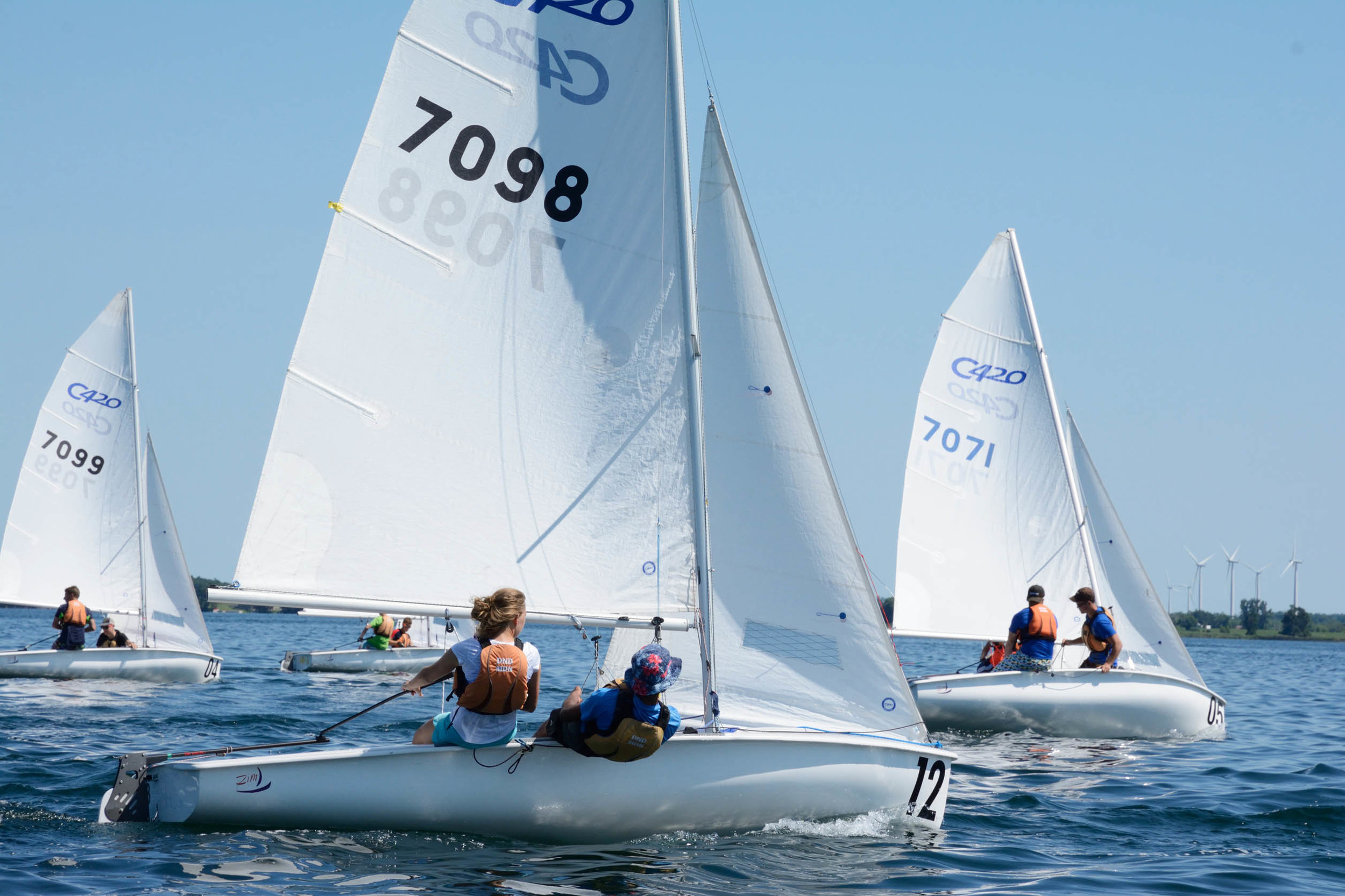 Sea Cadets Kate Langhorne and Vikas Memhi sail a 420 sail boat off the coast of CFB Kingson during the Advanced Sail Course. They are among 20 top young sailors from across Canada to be selected for the intense summer training program. (Sgt Kev Parle, DND).