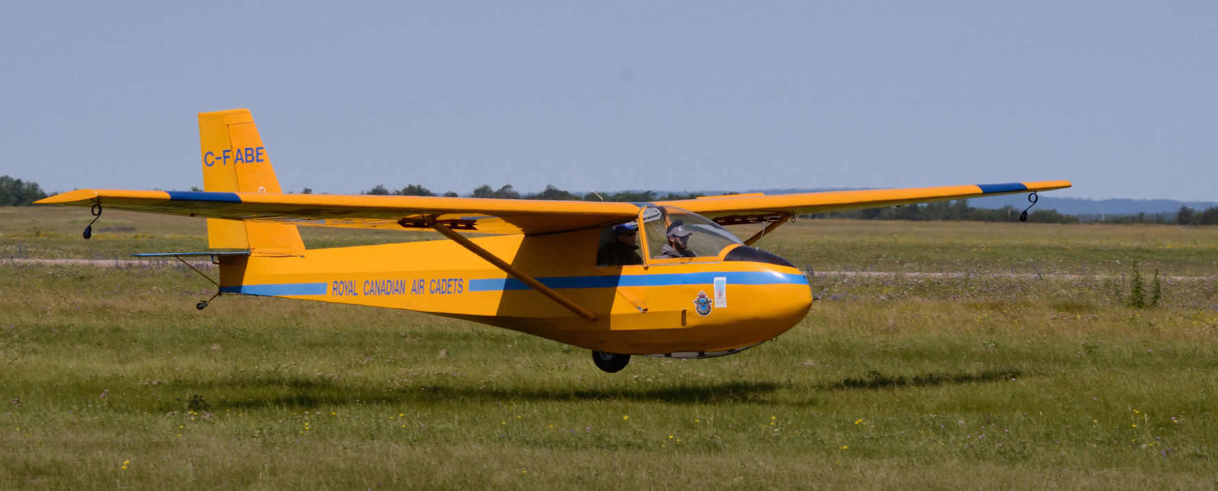 Air Cadet Divroop Panfer lands his glider on the grass along side the runway as he completes his flight. (Sgt Kevin Parle, DND)