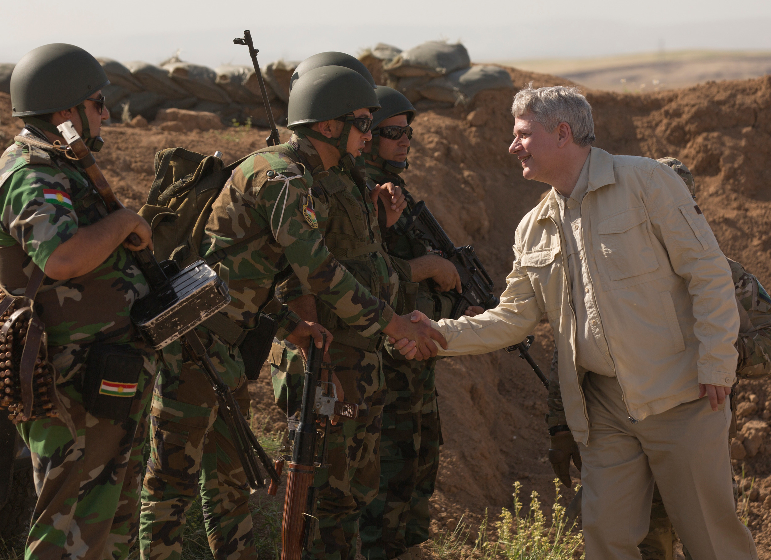 Prime Minister Stephen Harper greets Kurdish troops during a tour of allied operations in Iraq, May, 2015. For some reason the Kurdish Regional Government didn't make the invite list for a recent meeting of the anti-ISIS forces in Quebec City. (Jason Ransom, PMO)