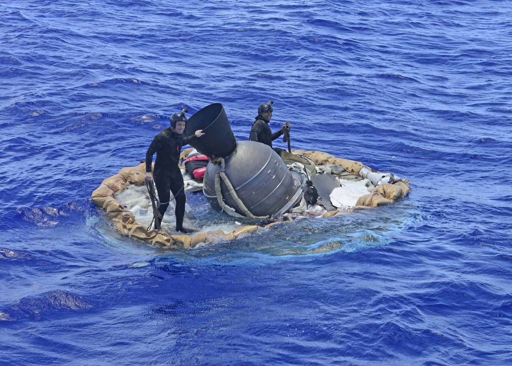 The lander, being retrieved from the Pacific Ocean. (NASA photo).