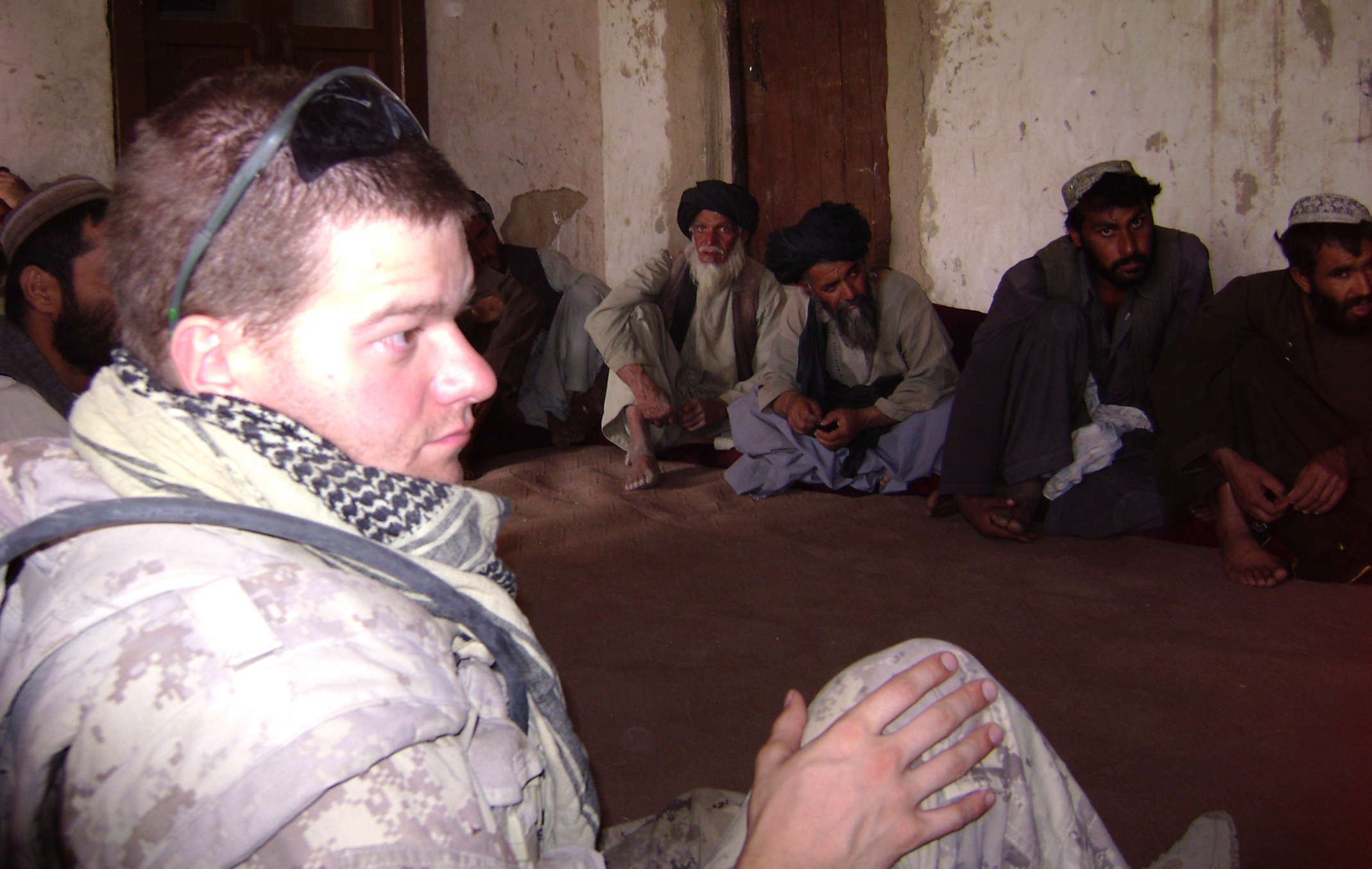Captain Simon Mailloux discusses security and development concerns with the heads of villages surrounding the Canadian base at Sperwan Ghar in Afghanistan. The Canadians in Sperwan Ghar had been under sustained rocket and ambush attacks and winning the support of the population was key to their effort. Captain Mailloux was injured in an improvised explosive device (IED) in Afghanistan in 2007, which resulted in the loss of his left leg.