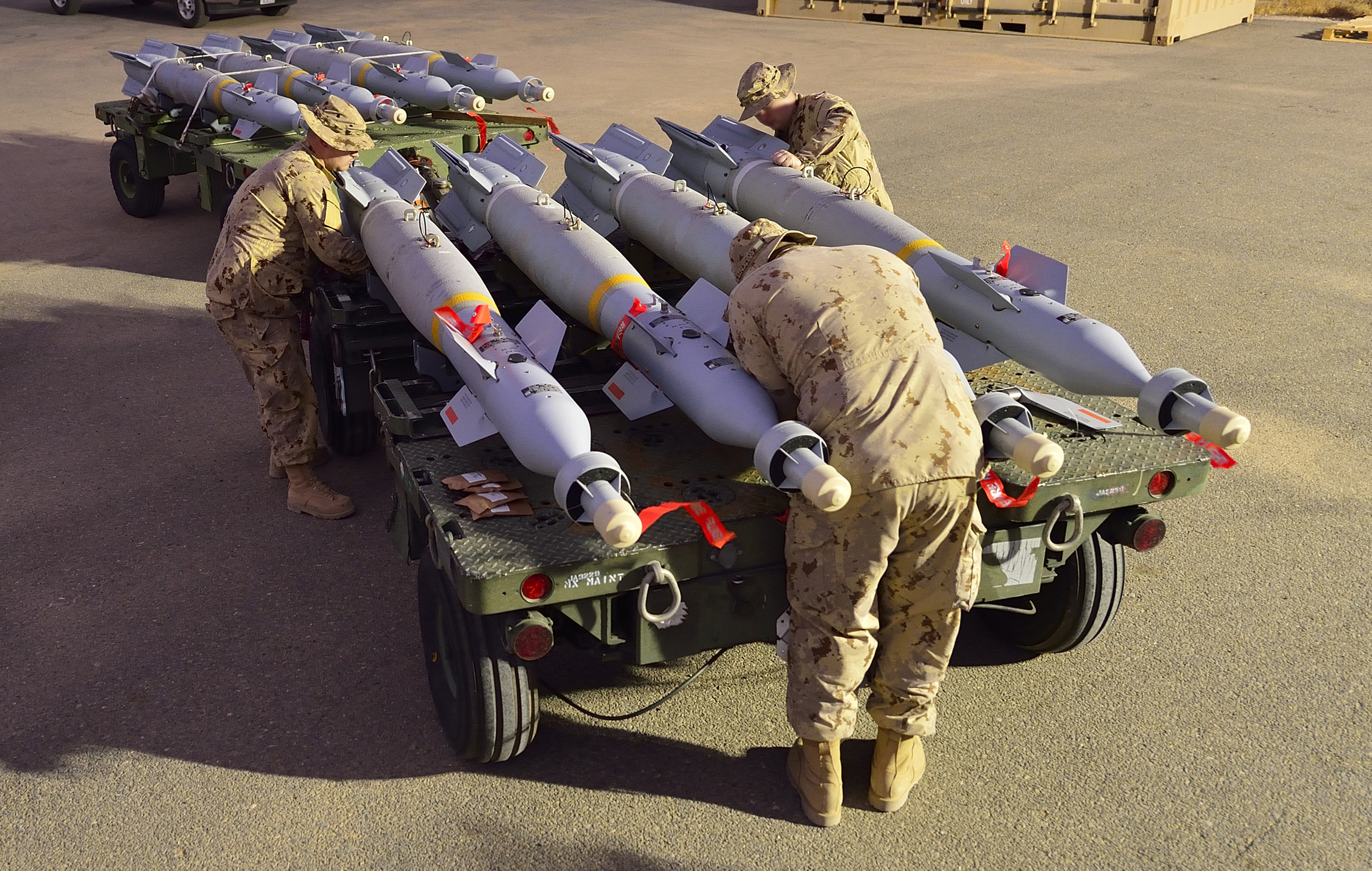 Canadian Armed Forces Ammunition Technicians in Kuwait assemble 500-pound guided bombs that will be mounted on CF-188 Fighter jets flying combat missions over Iraq during Operation IMPACT on October 31, 2014 . The RCAF would like to acquire low-collateral damage weapons (LCDW) for use in targeted missions over cities and "politically sensitive operations" to cut down on the likelihood of collateral damage. (DND)