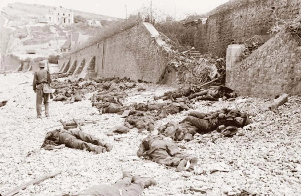 Canadian dead on Blue Beach at Puys. Trapped between the beach and high sea wall (fortified with barbed wire), they made easy enfilade targets for MG34 machine guns.