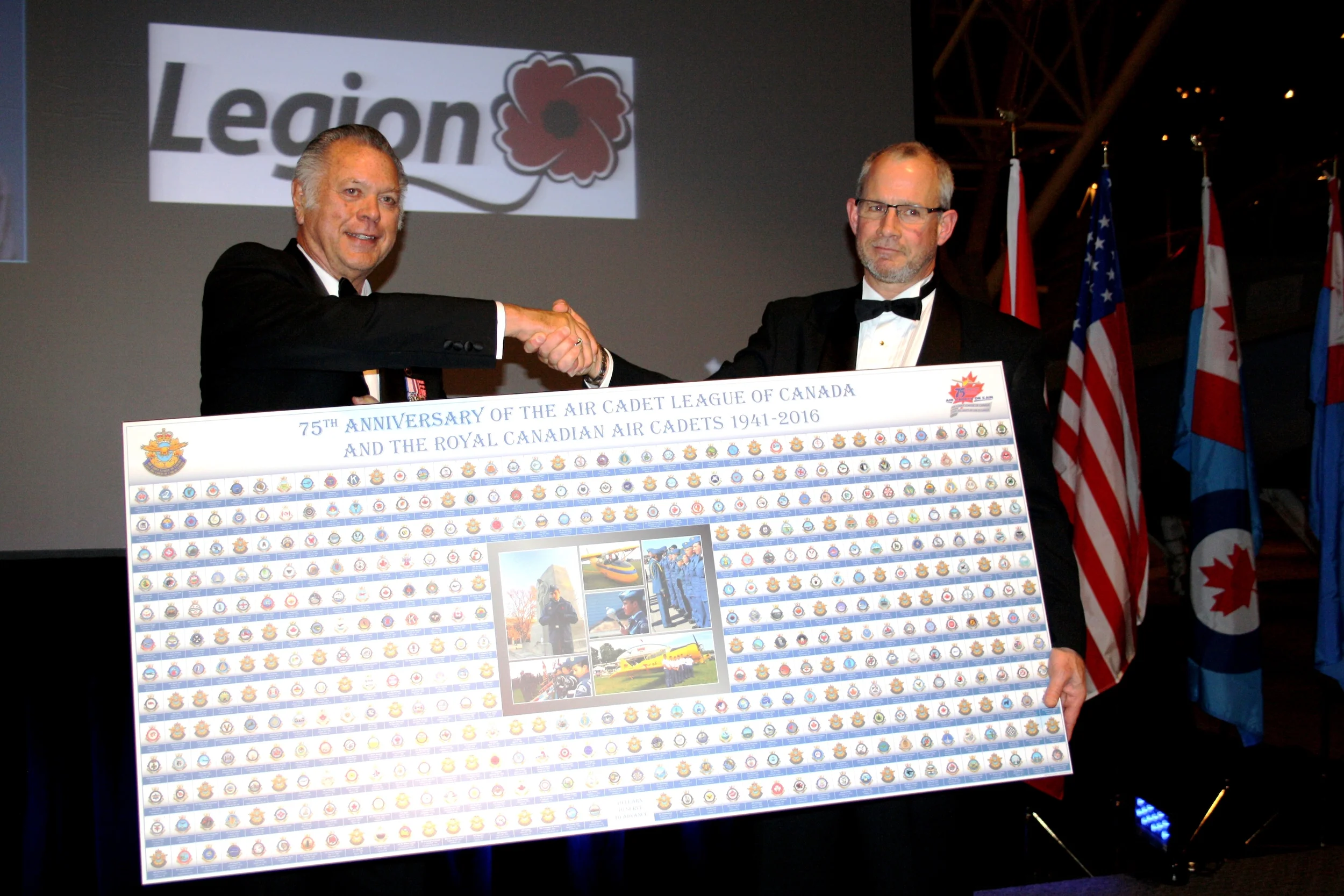  The event was an opportunity for the League to commemorate some important partnership with the Legion and RCAFA. The League's President, Mr. Don Doern gave Brad White, from the Royal Canadian Legion, a commemorative poster highlighting all the squadron's crests. (Sitraka Raoelimanohisoa)
