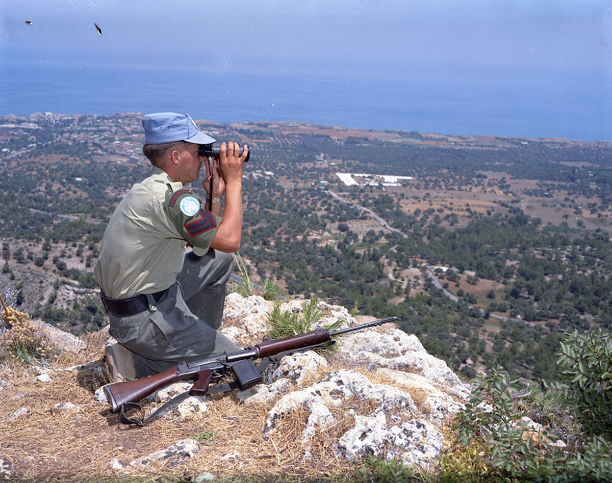 A member of the Royal Canadian Dragoons Reconnaissance Squadron, deployed as part of the United Nations Peacekeeping Force in Cyprus (UNFICYP), during a patrol. Canadian Armed Forces members have been deployed as a peacekeeping force since 1963. (DND, Library and Archives Canada)