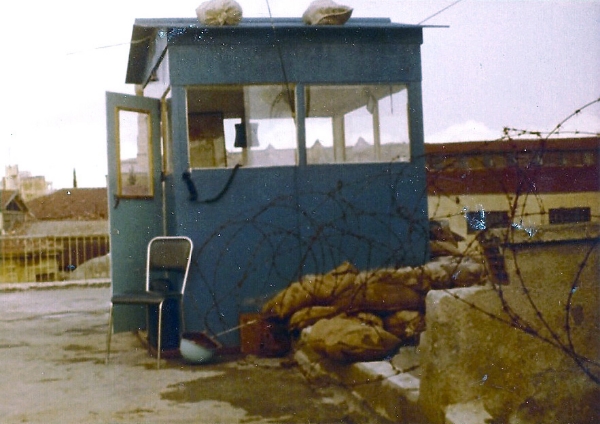 Observation Post Hermes, Nicosia, Cyprus, 1974. Notice the positioning of barb wire and sand bags to keep the bad people at bay. The sentry would sit on the chair with the radio receiver hanging out the window and within easy reach. The blue helmet is visible next to the chair, just in case. (Frank Reid)