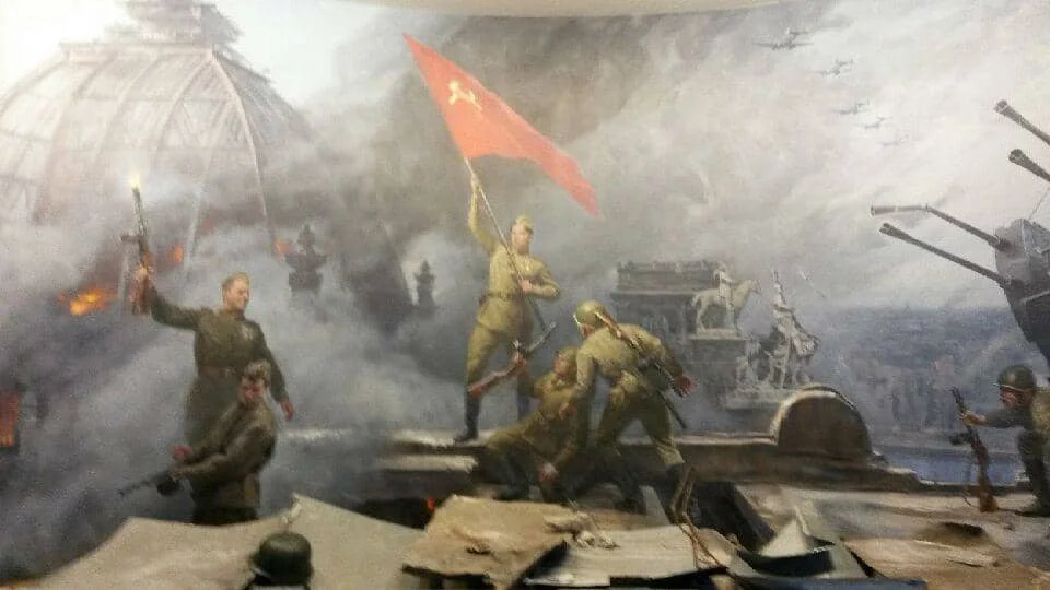 At the Astana war museum, a giant moral proudly depicts the Kazakh soldier who placed the Soviet flag atop the German Reichstag during the Battle of Berlin, May 1945