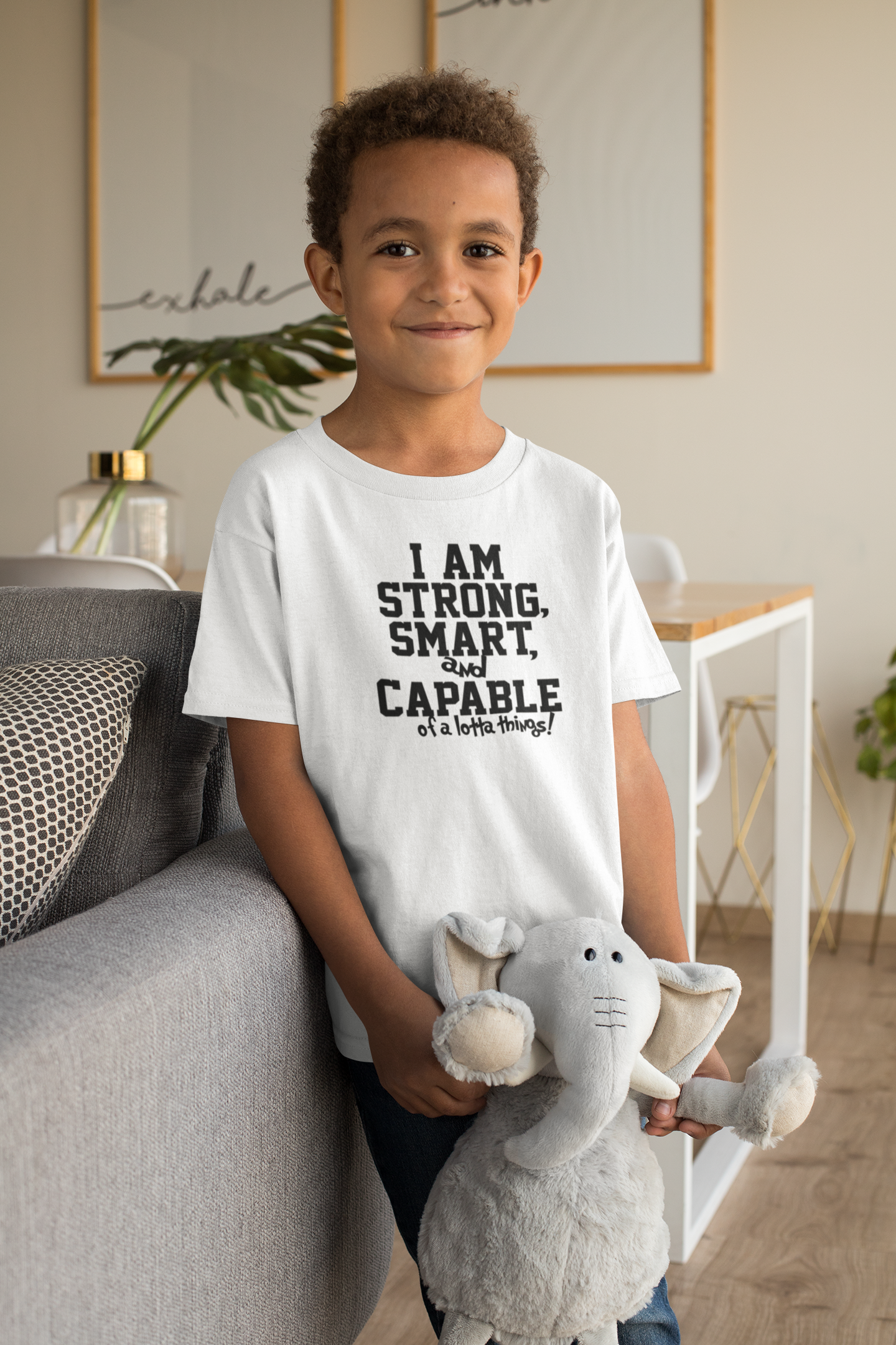 t-shirt-mockup-of-a-smiling-kid-with-a-cuddly-toy-31638 copy 2.png