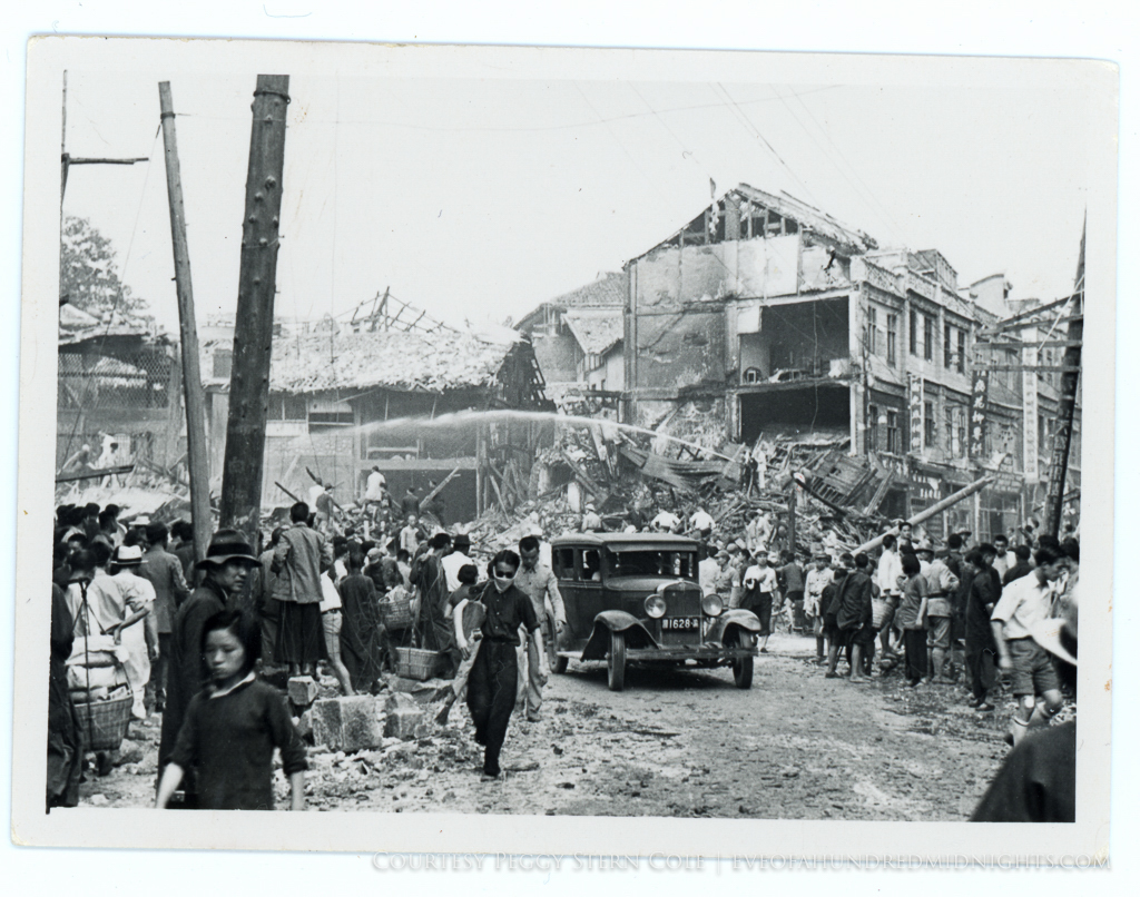 Collapsed Chungking Building after bombing With Crowd Scene and Hoses.jpg