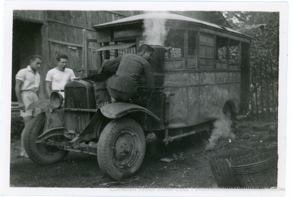 Lingnan Students watching as man fixes jalopy.jpg