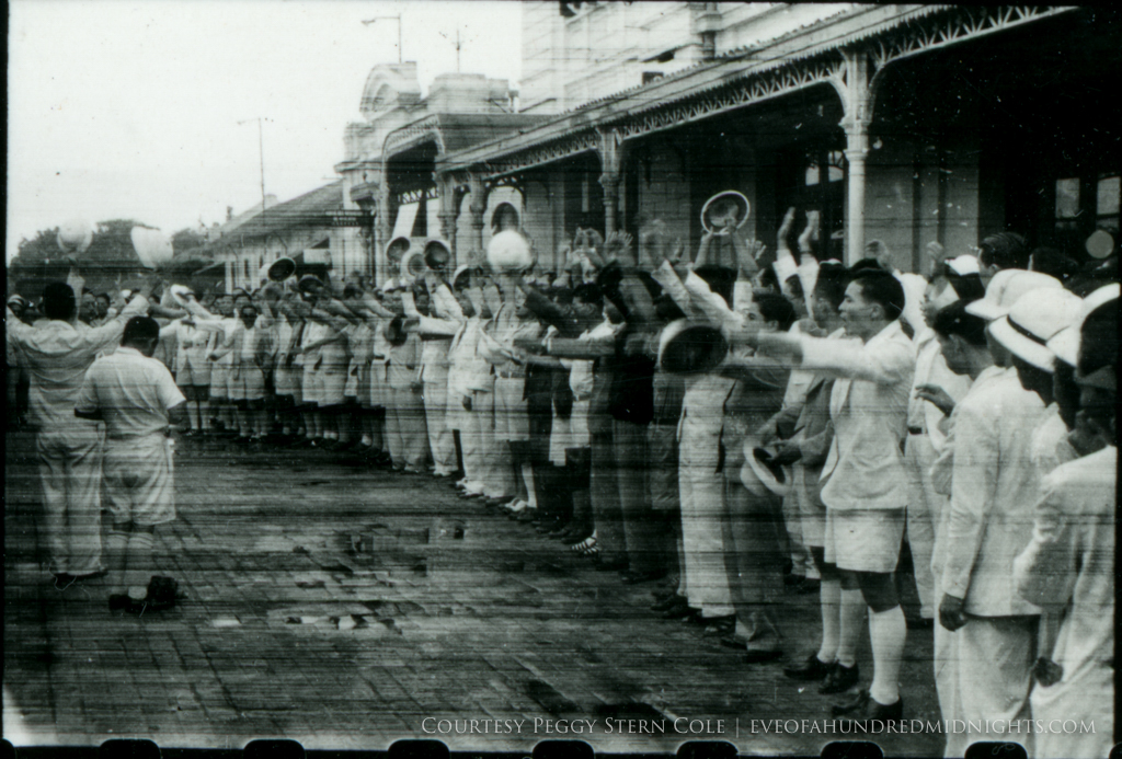 Crowd cheering at train station from exposed negative.jpg
