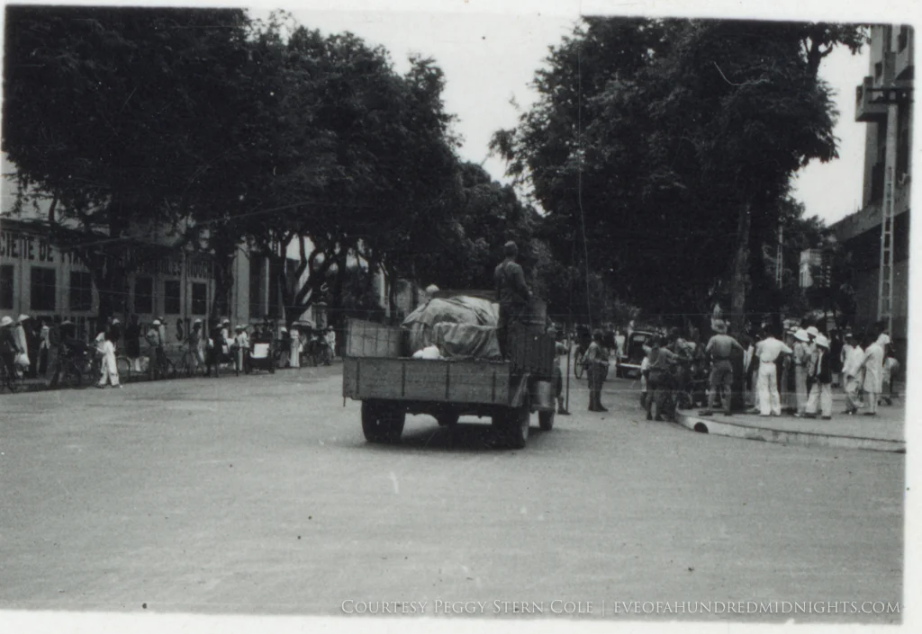 Japanese Soldier on Truck Passing Indochina intersection.jpg