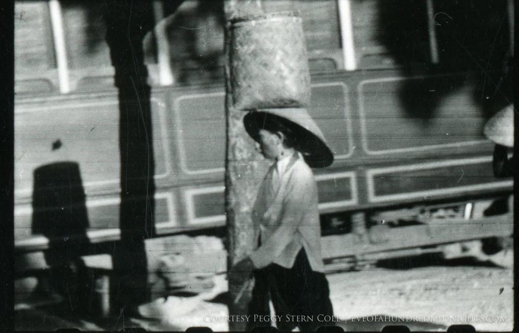 Lady With basket on head in Hanoi.jpg