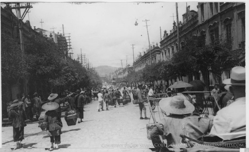 Rickshaw Pullers and Vendors in Hanoi Street.jpg