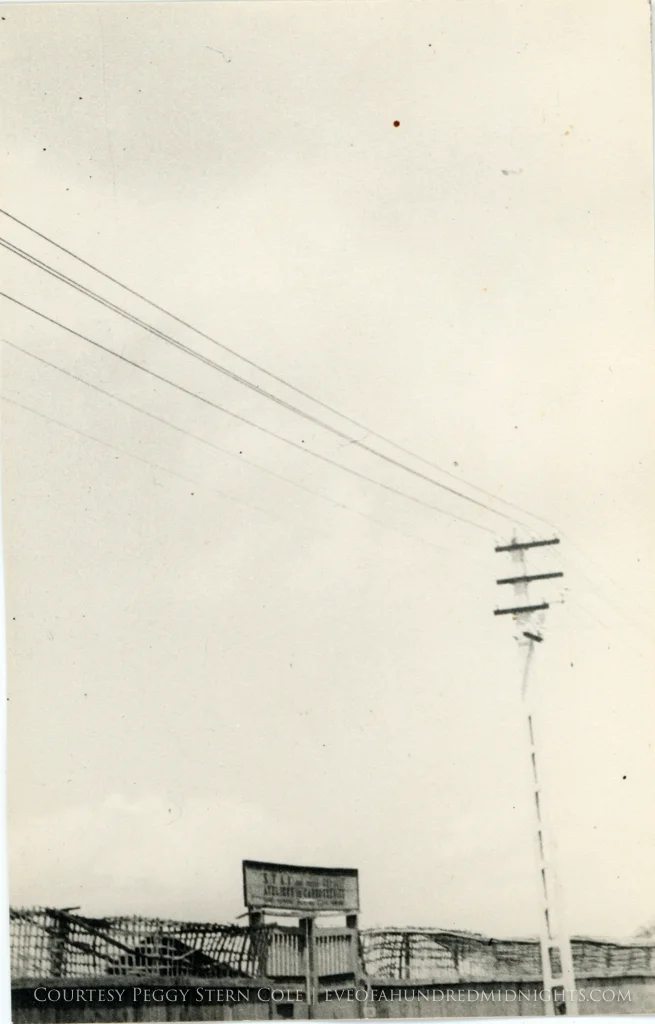 Shot of fence and power lines at warehouse somewhere.jpg