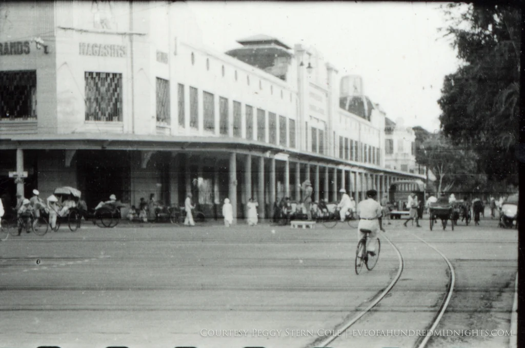 Streetcar tracks and bikes in front of Grands Magasins Hanoi from negative.jpg