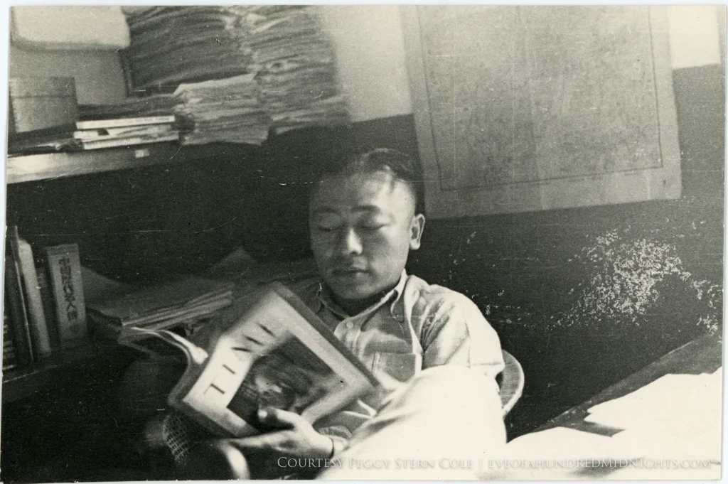 Man in Press Hostel Reading Time Magazine.jpg