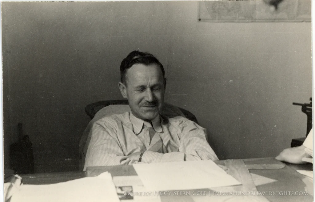 Mo Votaw Squeezing Eyes Closed at Desk.jpg