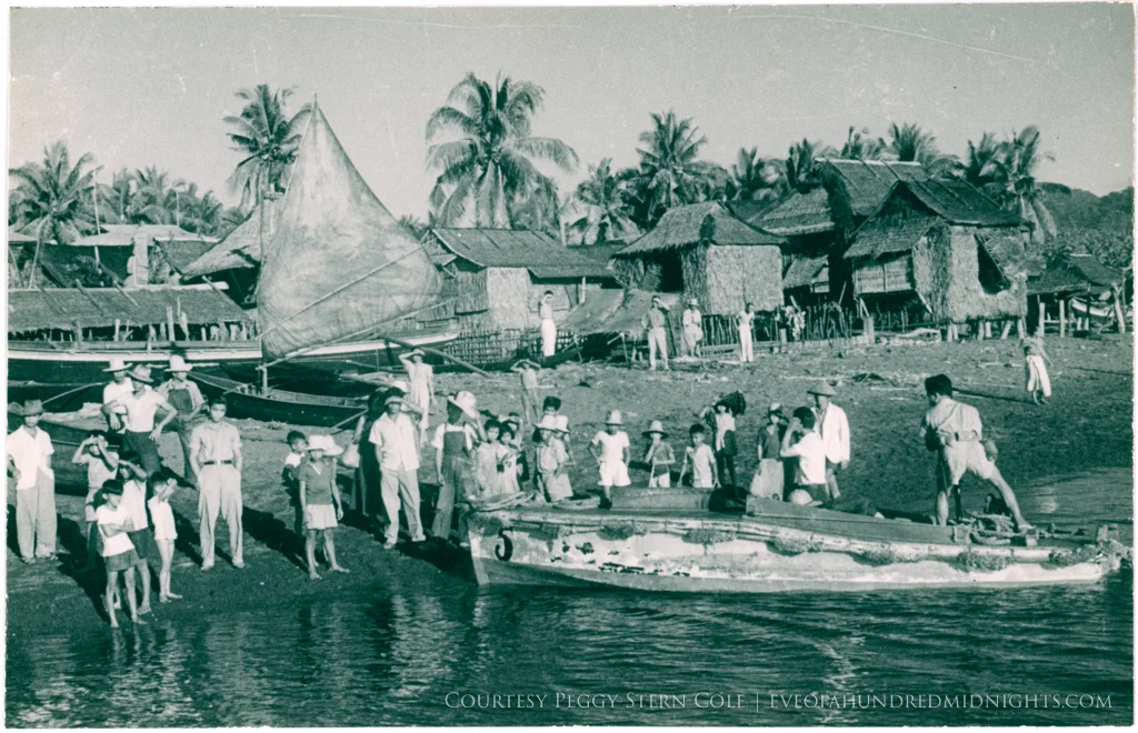 Boat pulling up at Philippines Village.jpg