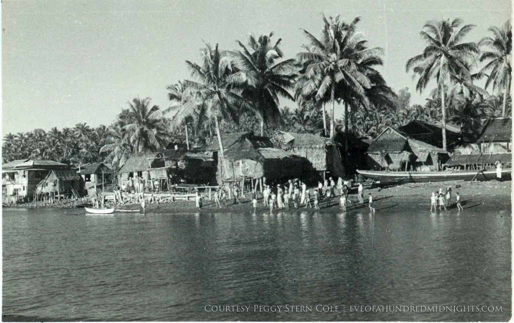Shacks on Philippines Beach With Villagers.jpg