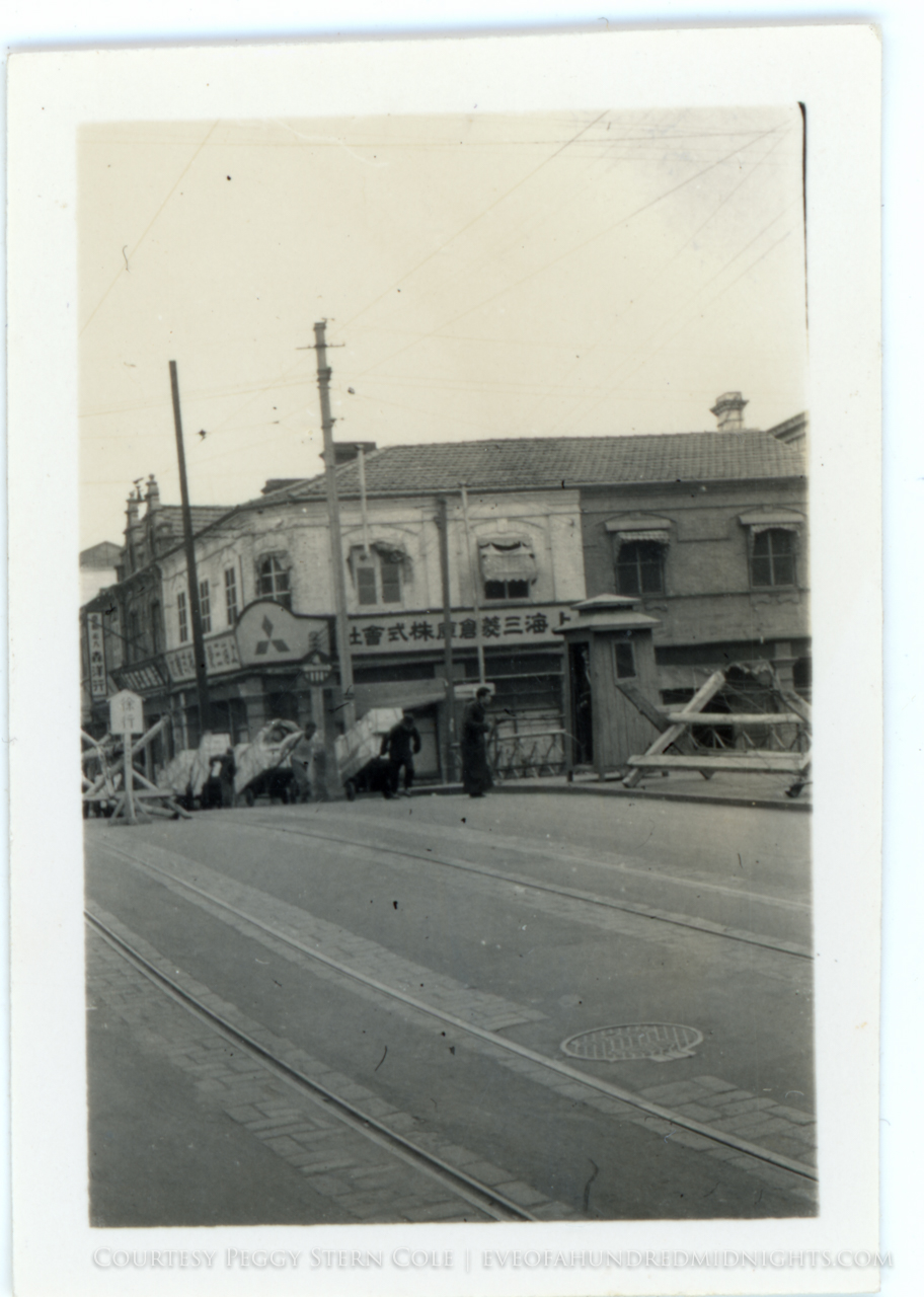 Men at Japanese Checkpoint by Mitsubishi storefront in Shanghai.jpg