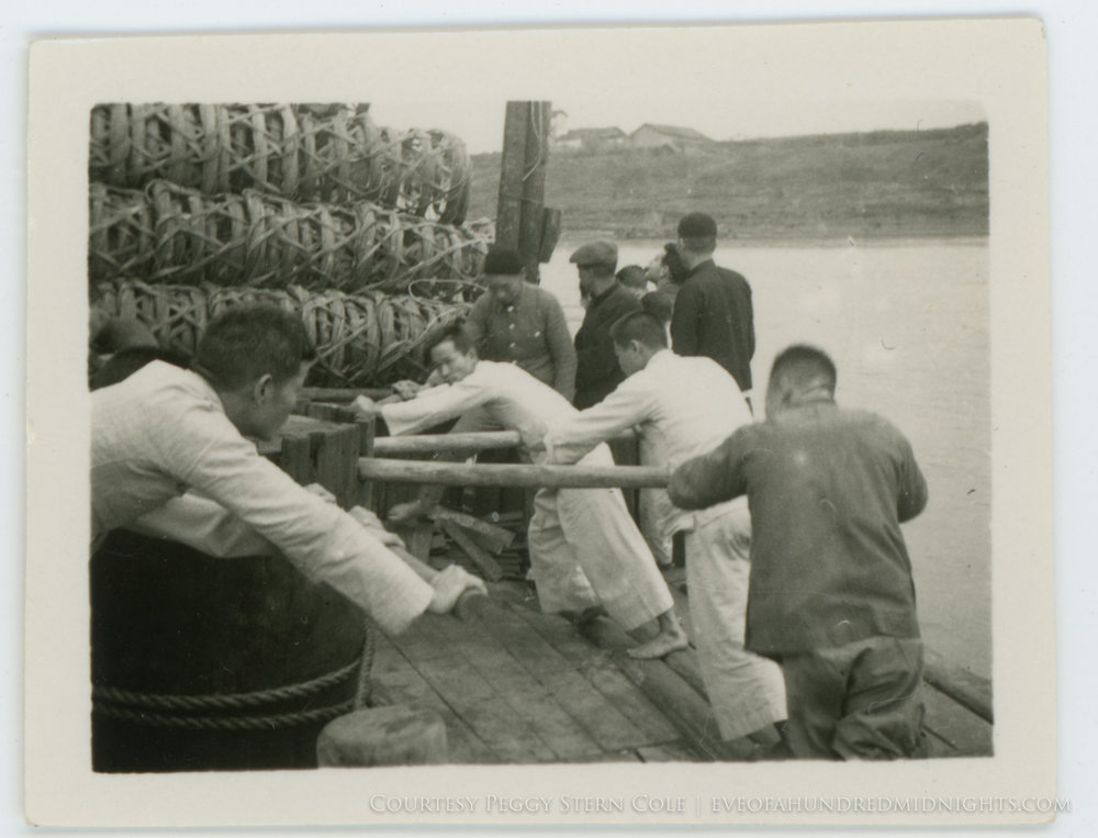 Men pushing wheel on Pearl River Barge.jpg