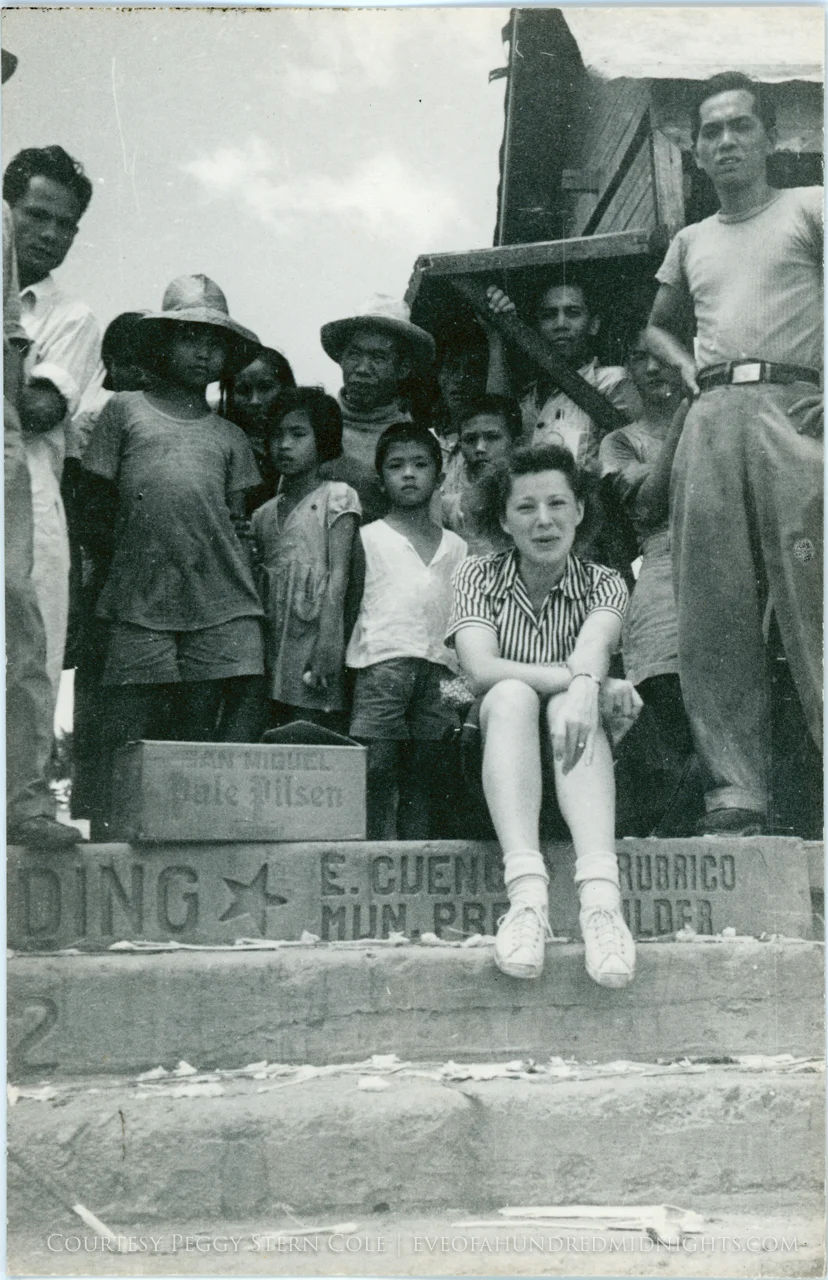 Annalee on steps next to beer case.jpg