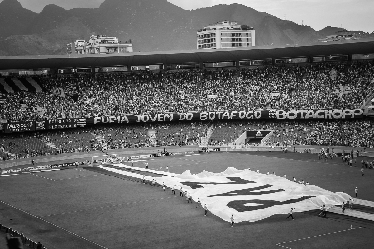 Before the game starts a big banner saying "Peace", is brought to the center of the field along with banners with the colors of the two teams.