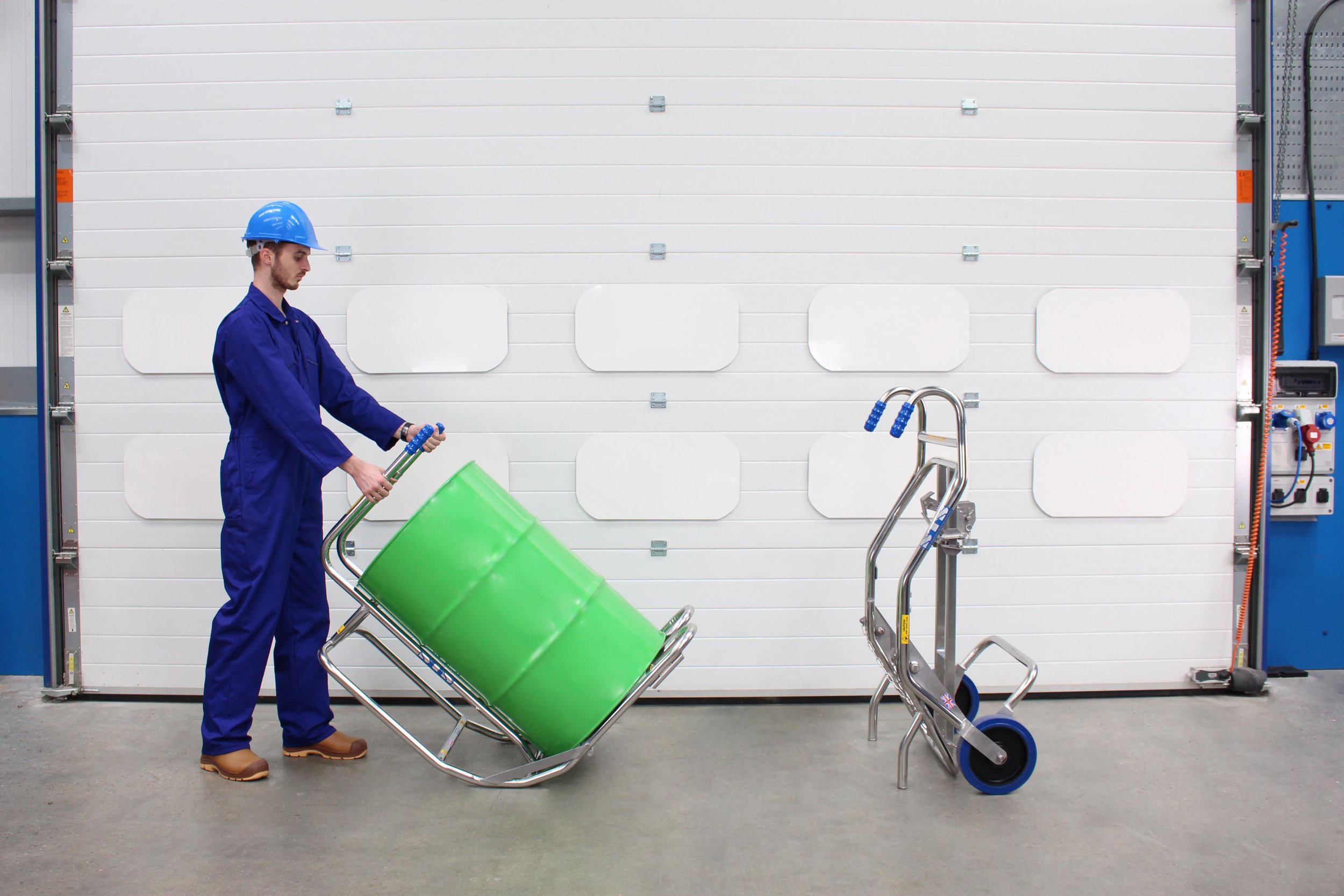 Operator move a drum into the vertical postion using the Drum &amp; Barrel Rollover Cradle