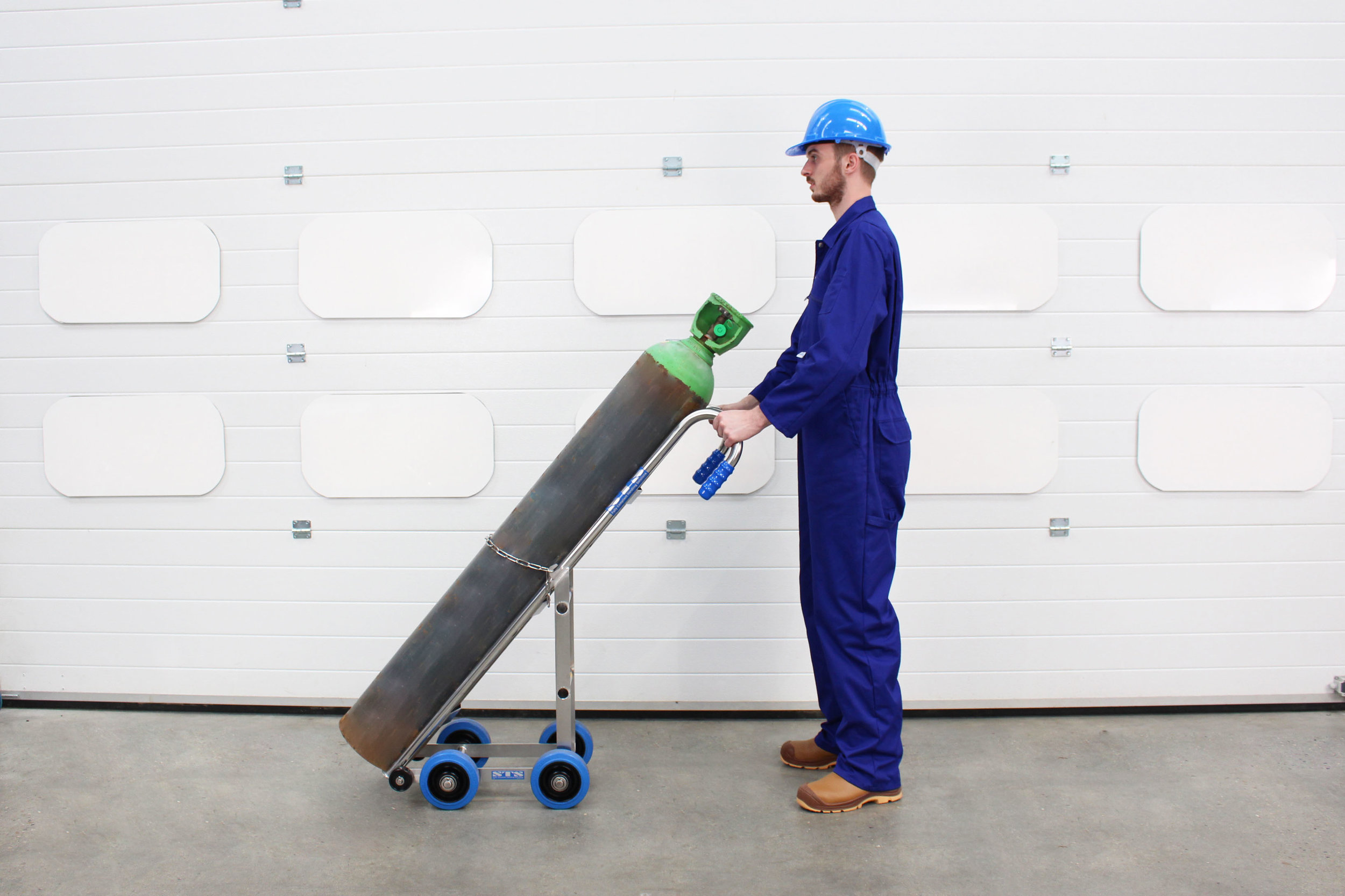 A cylinder is transported by a operator using a Gas Cylinder Hand Truck 