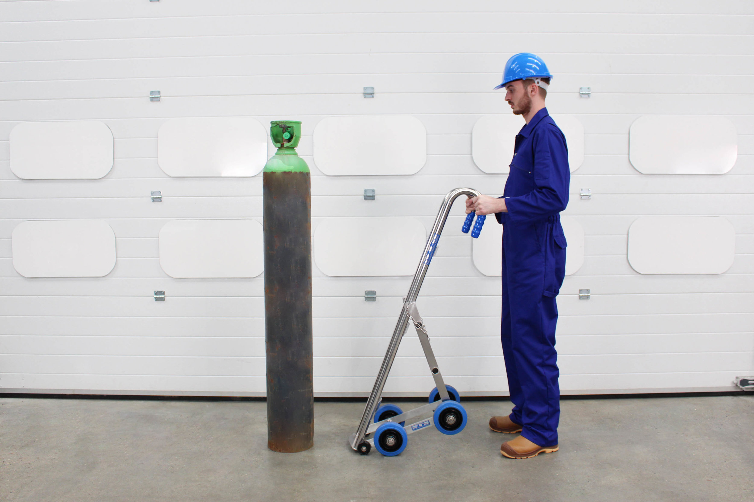 A operator approaches a cylinder using the Gas Cylinder Hand Truck 