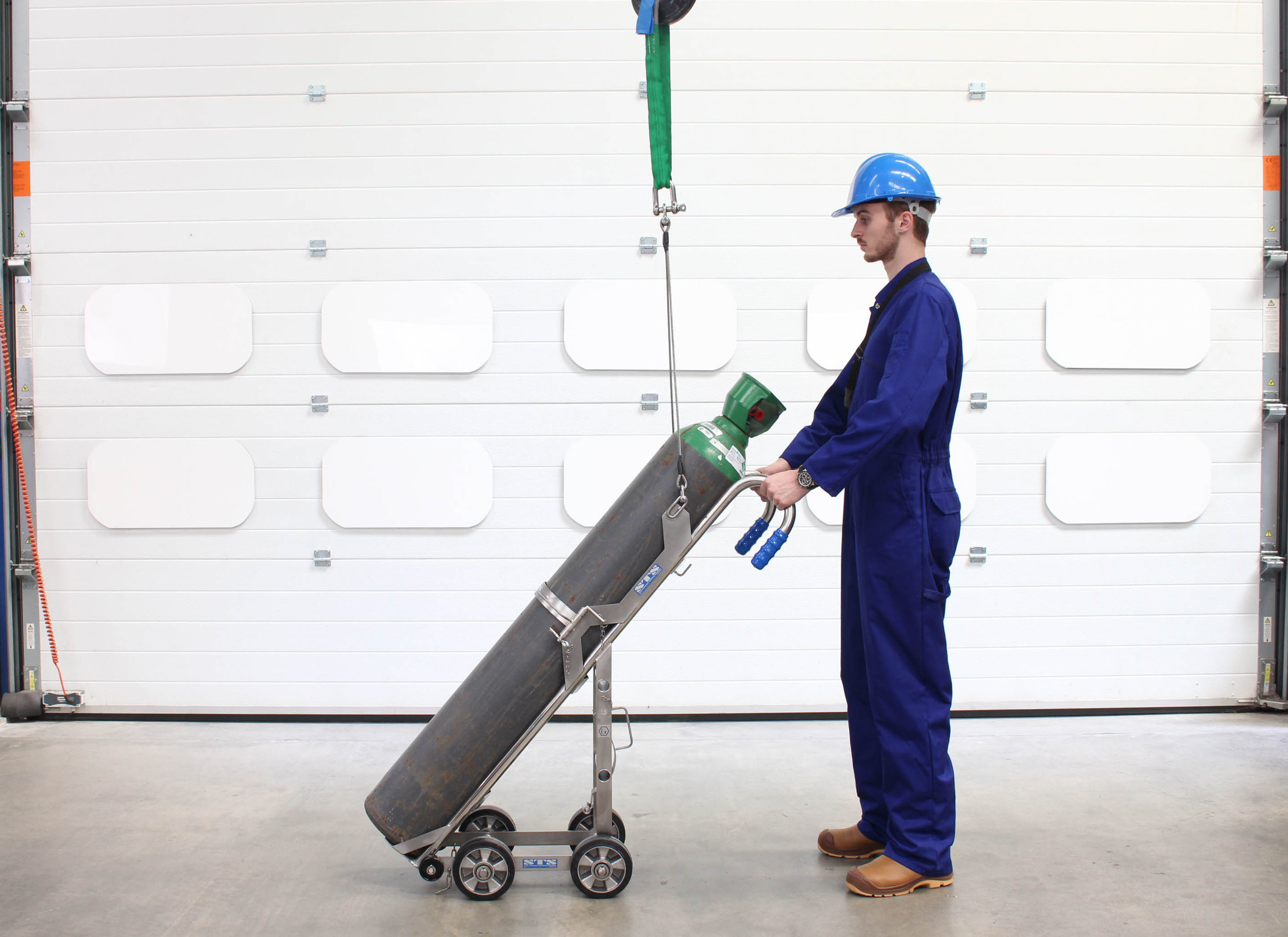 Operator safely handles cylinders using a Gas Cylinder Hand Truck 