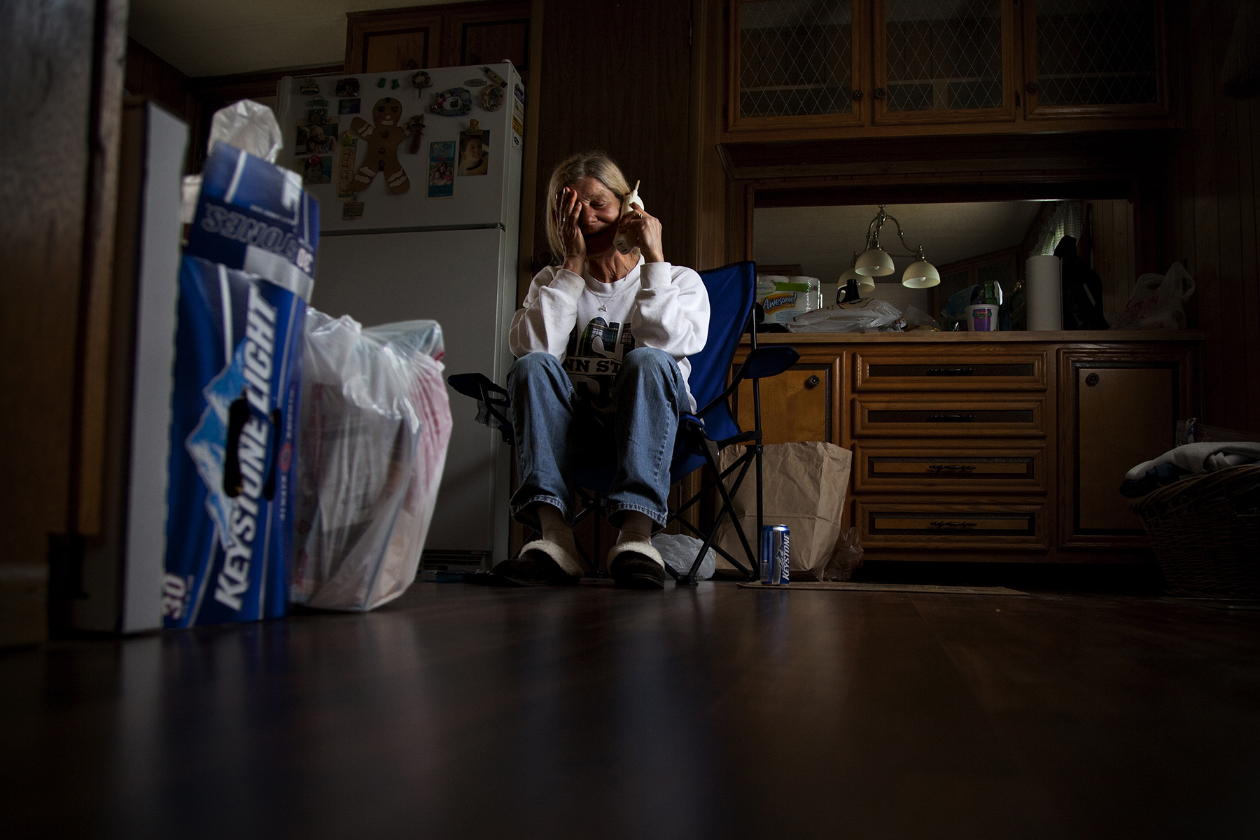 Diane Smith, 58, talks with her mother on the phone about the eviction. She lived in Riverdale Mobile Park for fifteen years and thought she would retire there.