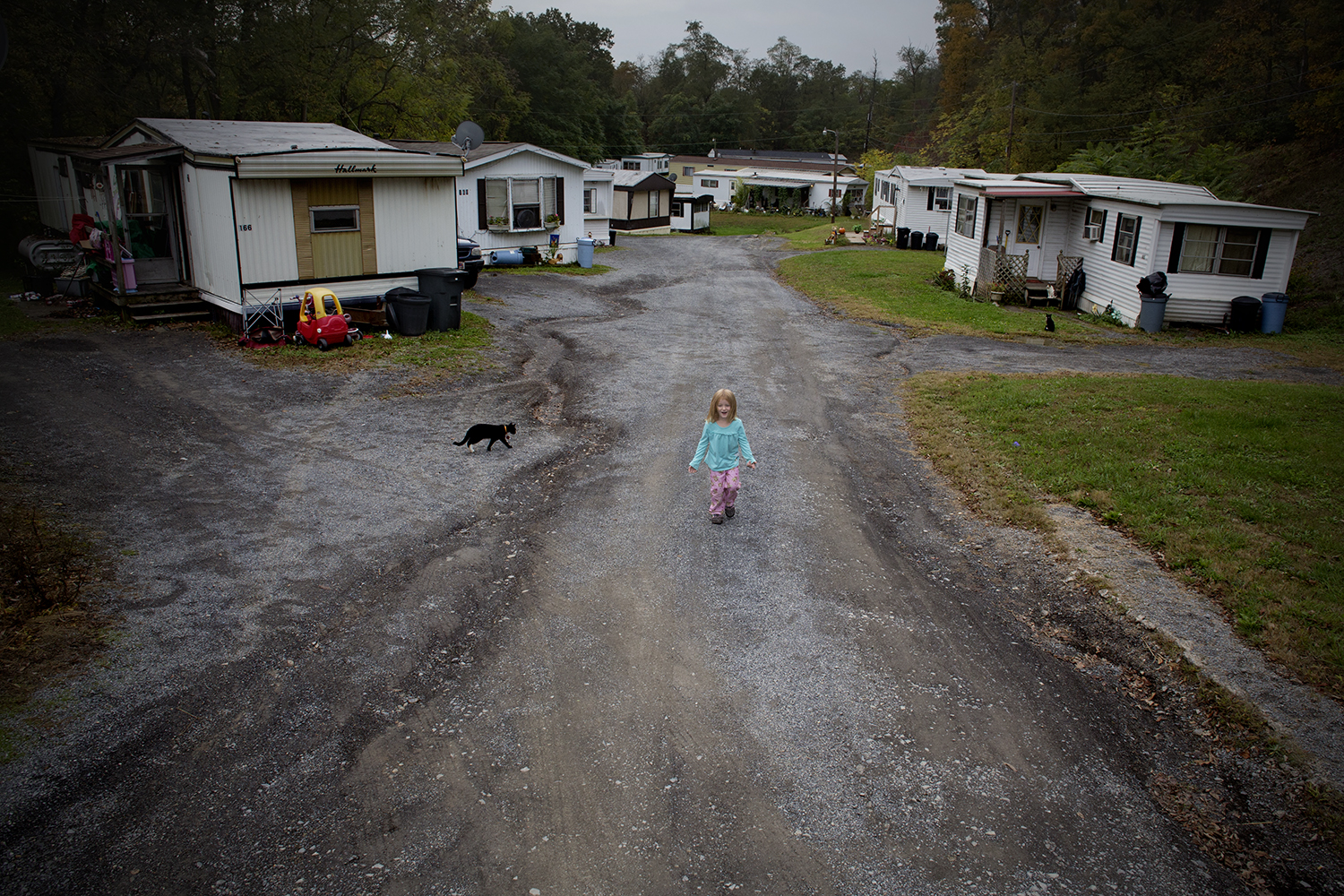 Jeanna Daniels, 4, plays outside in her new neighborhood, Corners Trailer Park in Jersey Shore, PA.