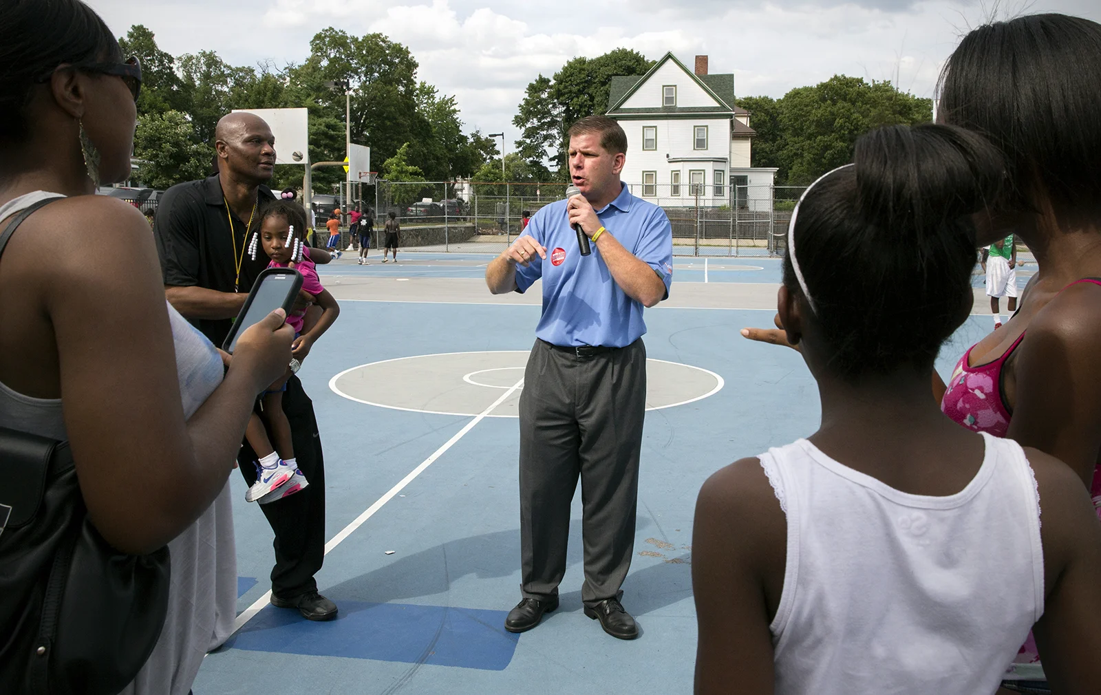 Mayoral hopeful, Marty Walsh, speaks with Boston youth during a Scoops 'N Hoops event in Dorchester, MA. July 27, 2013 